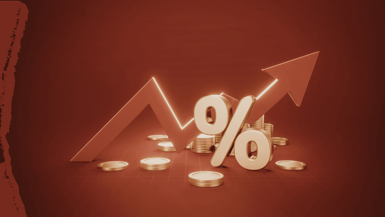 A construction project manager and a fractional CFO reviewing financial charts and blueprints on a tablet at a job site.