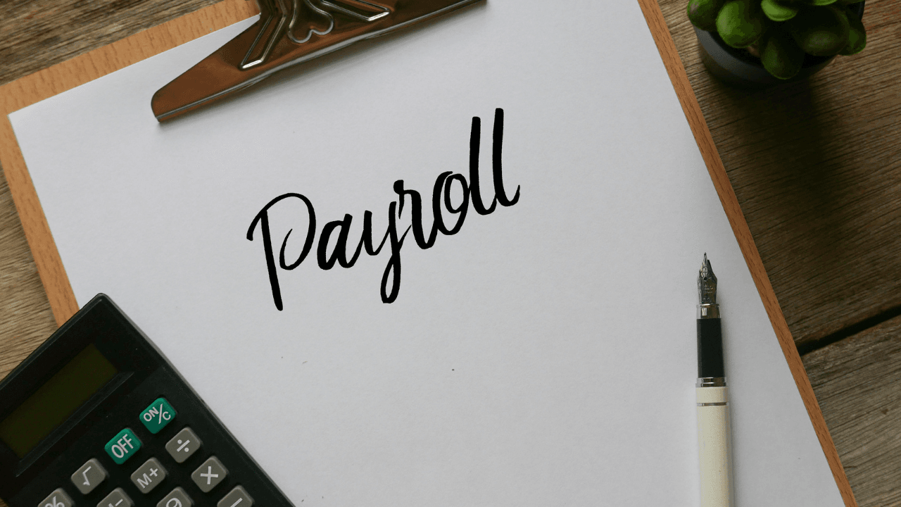 Contractor reviewing payroll documents to avoid payroll mistakes on construction projects