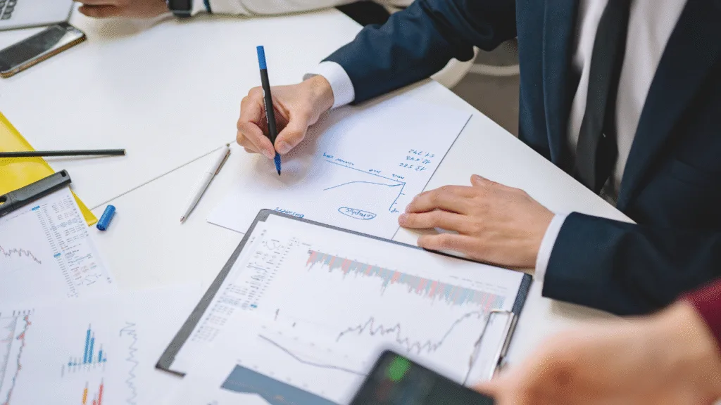Financial controller reviewing construction project budgets and cash flow dashboard