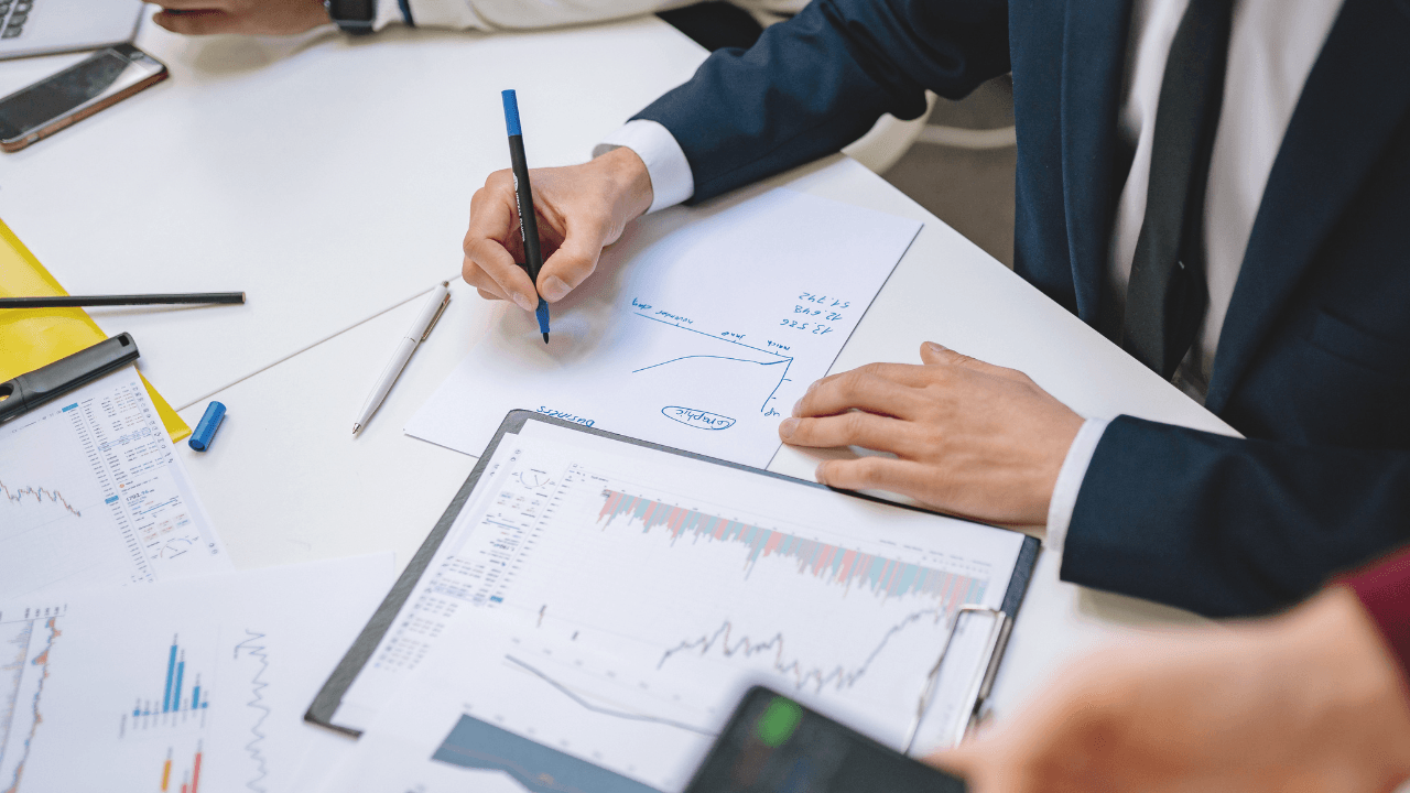 Financial controller reviewing construction project budgets and cash flow dashboard